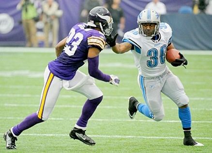 Jerome Harrison on the field with another football player