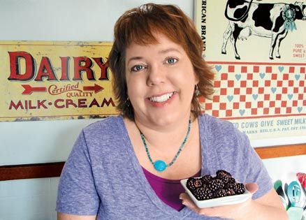 Peggy Frezon, holding a bowl of heavenly berries