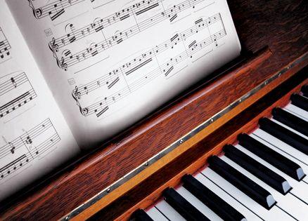 Sheet music placed on a lovely old piano