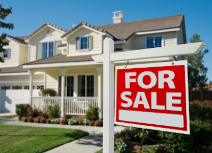 beautiful home with a for sale sign