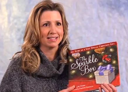 Author Jill Hardie holds her book, The Sparkle Box