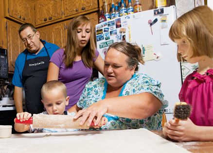 Dora Aandedur teaches her grandkids to make lefse.