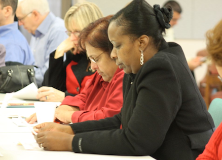 OurPrayer staff praying on Thanksgiving Day of Prayer.