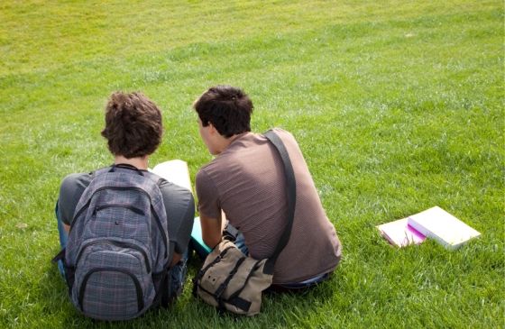 college roommates sitting on the lawn