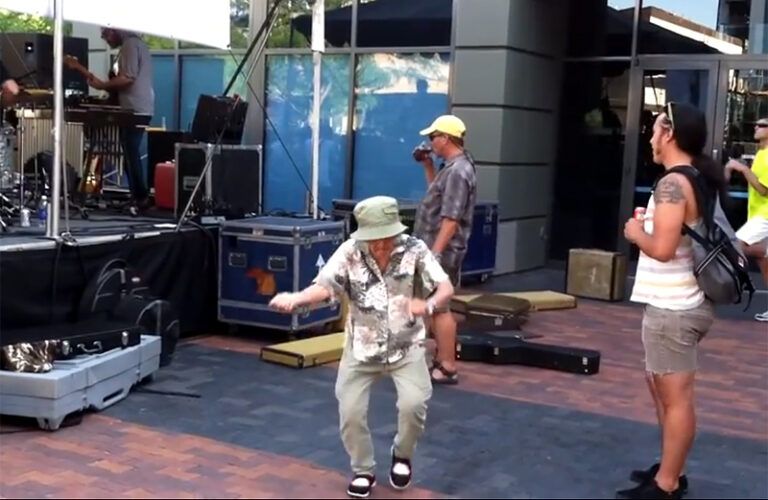 A spry senior citizen dances to some rock 'n' roll.