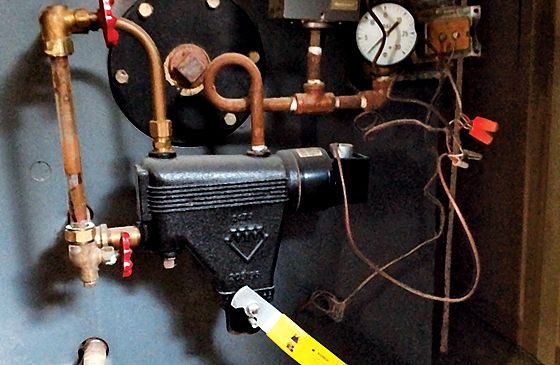 The controls of an old basement furnace