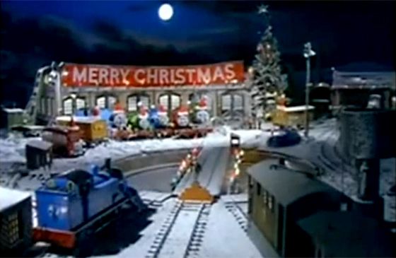 Toy trains outside a diner festooned with Christmas decorations