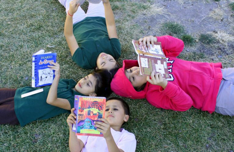 Children reading as part of U.S. Dream Academy's Read to Achieve Read-a-thon