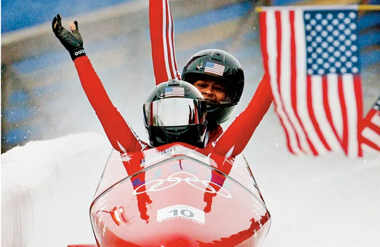 Vonetta (rear) and Jill cross the finish line in record time in 2002.