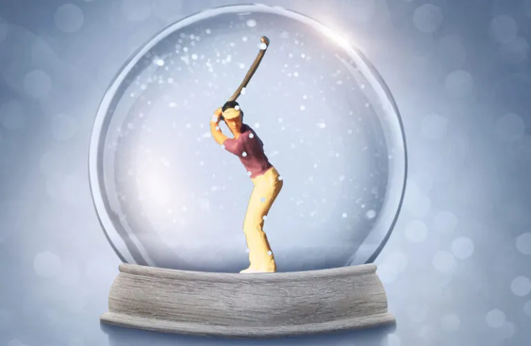 A golfer snowglobe