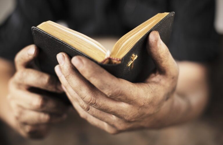 man holding the Bible