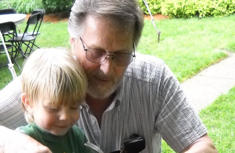 Shawnelle's son and dad working on a birdhouse.