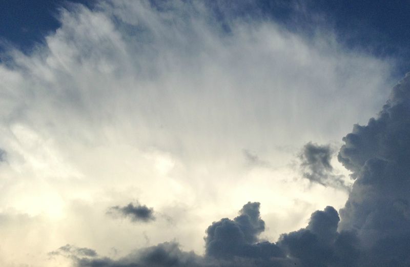 Rays of light piercing the sky.