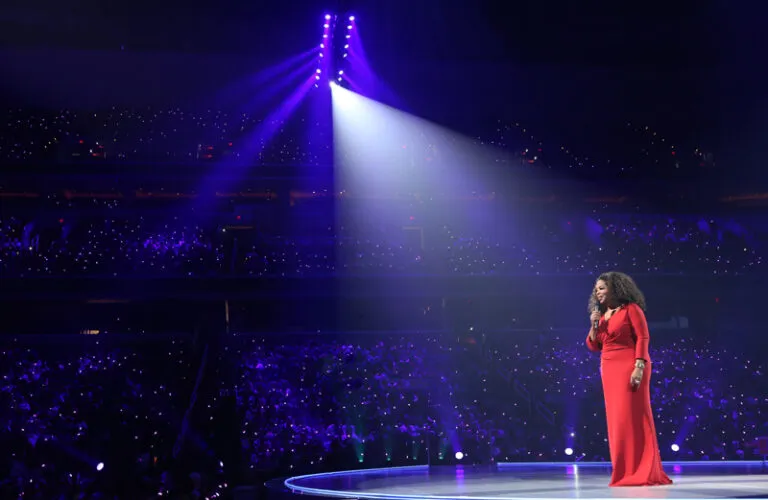 Oprah Winfrey in the spotlight on stage at the Verizon Center