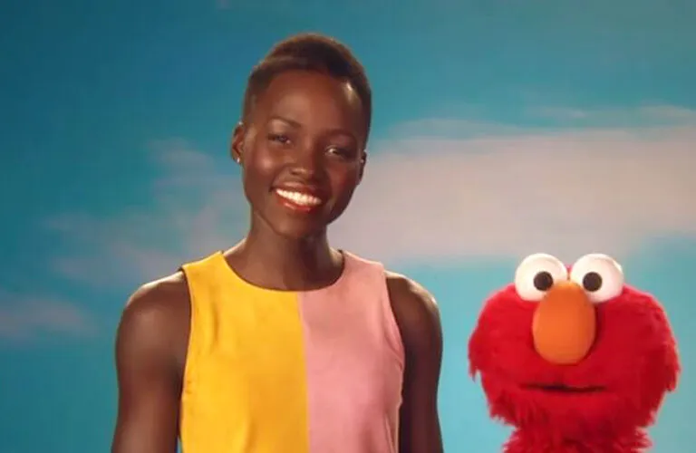 Actress Lupita Nyong'o poses with Elmo on Sesame Street