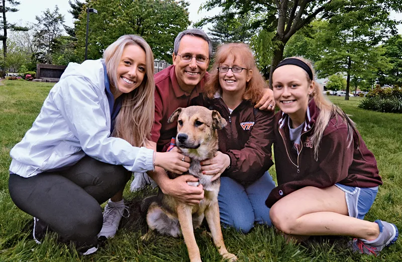 George with his wife, Alice, daughters, Ella (left) and Caitlin and Cubby