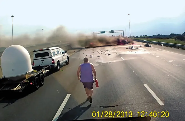 David Fredericksen rushes to help a woman and a child trapped in a burning car.