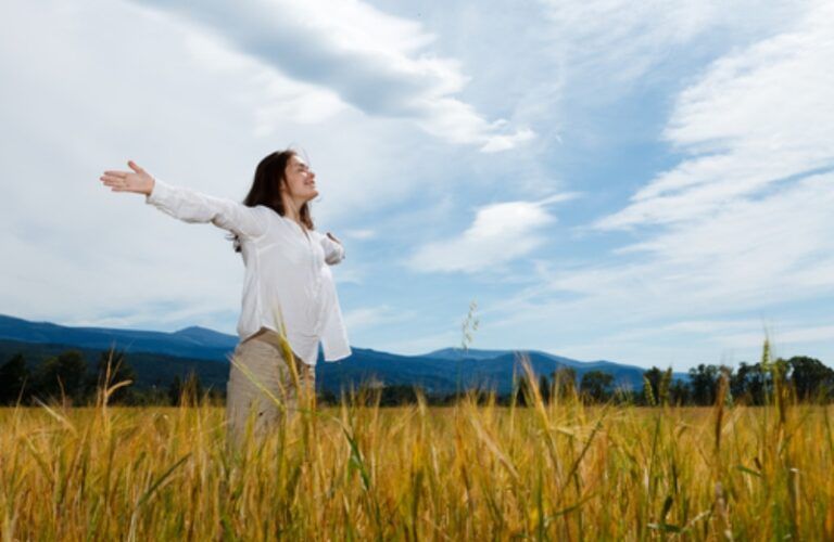 woman with arms outstretched