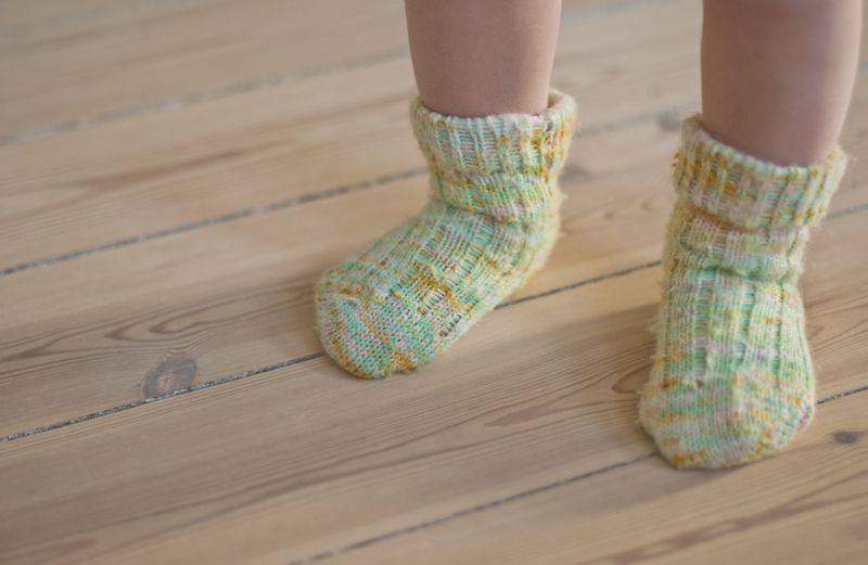 A baby's first steps. Photo by Marina Ch, Thinkstock.