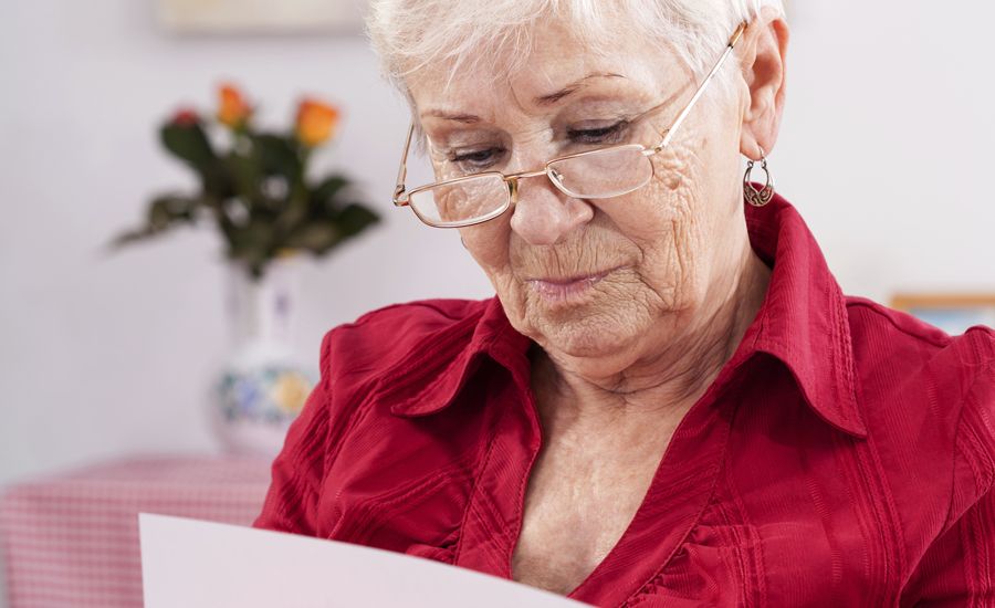 A woman reads a birthday card