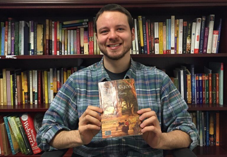 Daniel Kessel holding his copy of Jane Austen's Persuasion.