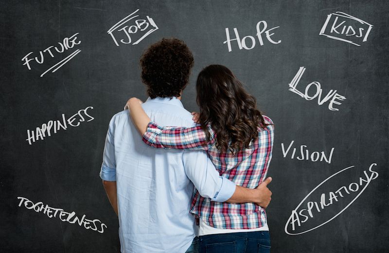 A couple prays for each other. Photo by Rido, Shutterstock.