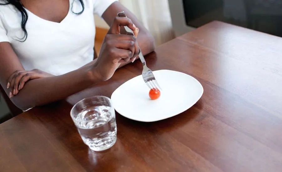 A teen girl under-eating. Photo: 123RF(r)