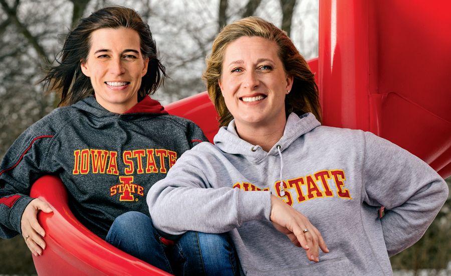 Kim (left) and Marti pal around on the playground.