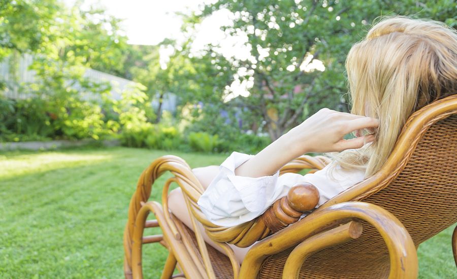 Woman resting in a rocking chair. Good for the soul!