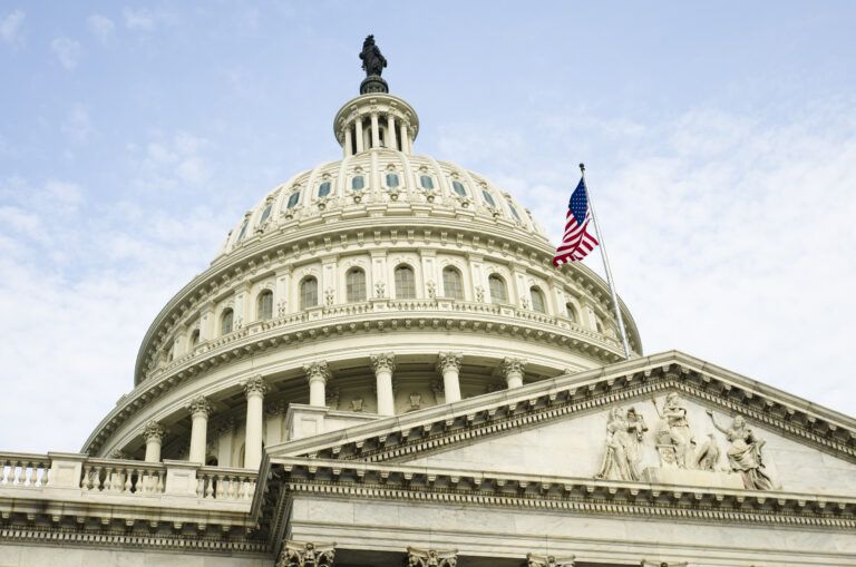 The American Flag flying atop Capitol Hill in Washington, D.C.