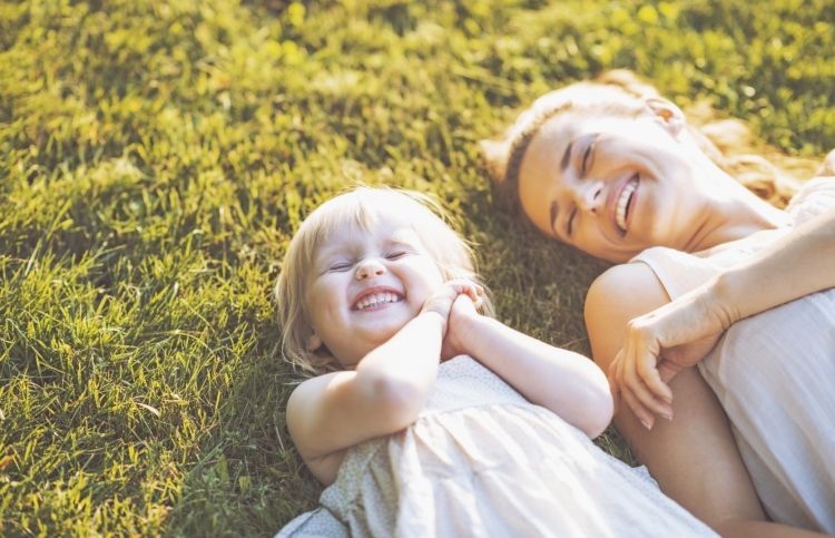 Mother and daughter in the sun, feeling God's love