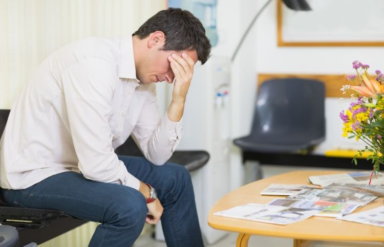 Man anxiously waits in a doctor's waiting is reassured by God's comfort.