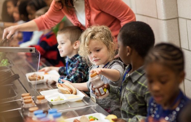 School Children enjoying school free lunch: Join us in prayer to end world hunger