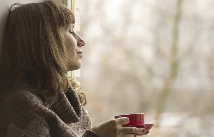 Woman looking out window