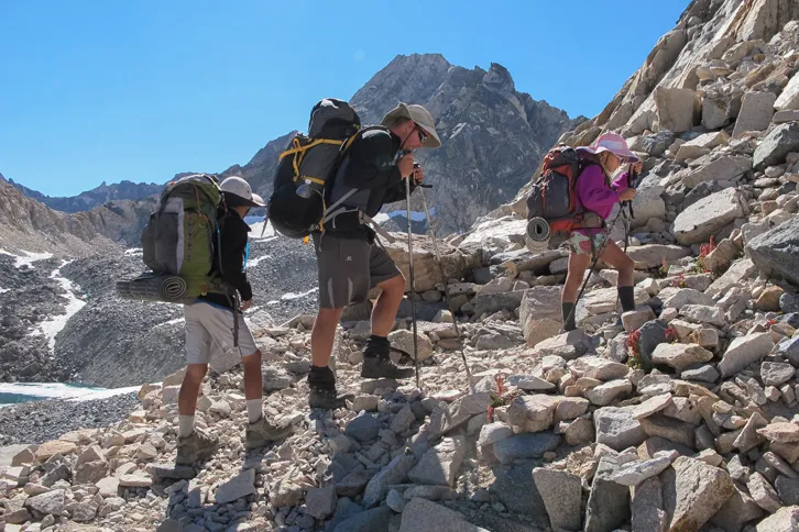 Guideposts: Cory, Cade and Rebekah hike up a rocky hillside