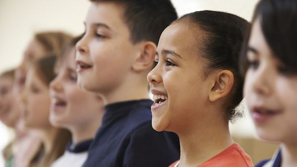 The joy of children singing praise to God.