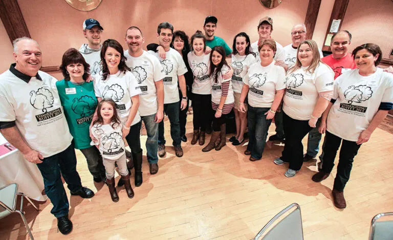 Jean (center, in black) and her whole family volunteer at the community Thanksgiving buffet.