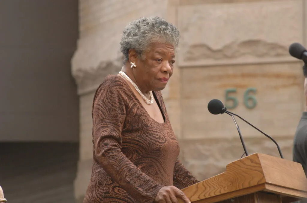 Maya Angelou stands at a podium as an inspirational figure during Black History Month