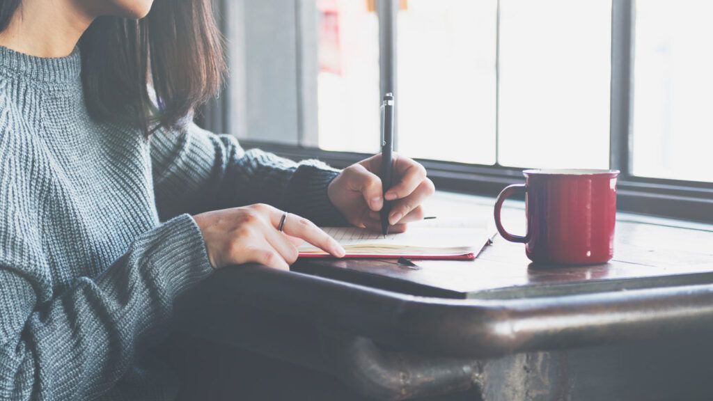 Woman checking off To Do List