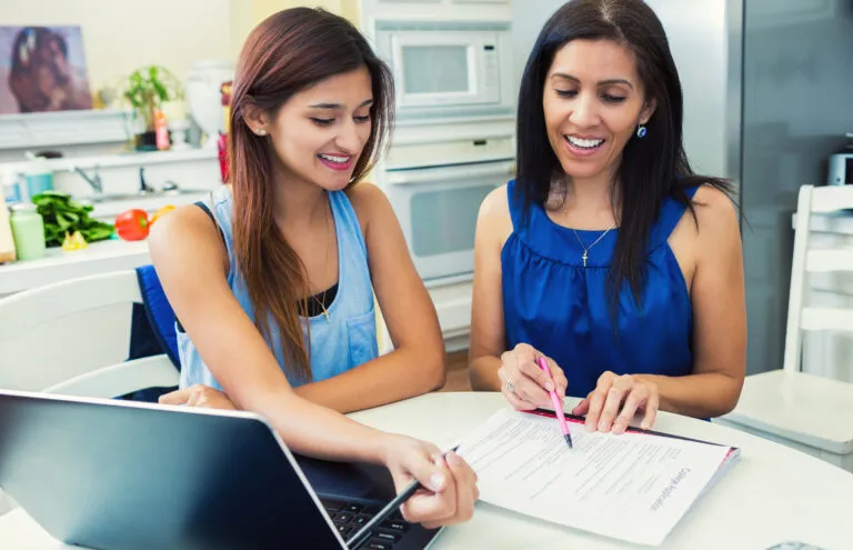 A woman mentors a graduate student