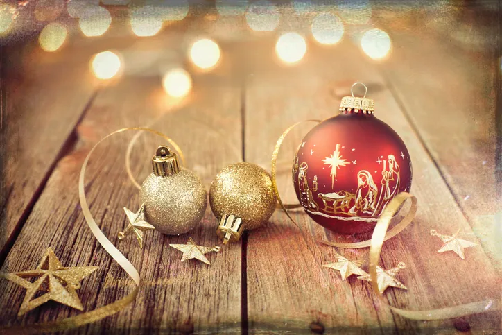 Christmas ornaments on a wood floor for a Christmas devotion