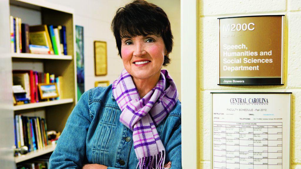 A portrait of Jayne Bowers leaning against the Social Sciences department office.