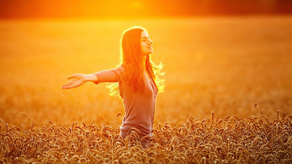 Woman smiling in a wheat field