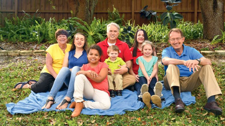 With parents in the back row, grandparents on either end, the Burklew kids take center stage.