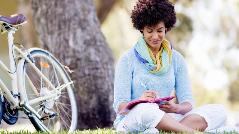 Woman writing in her journal