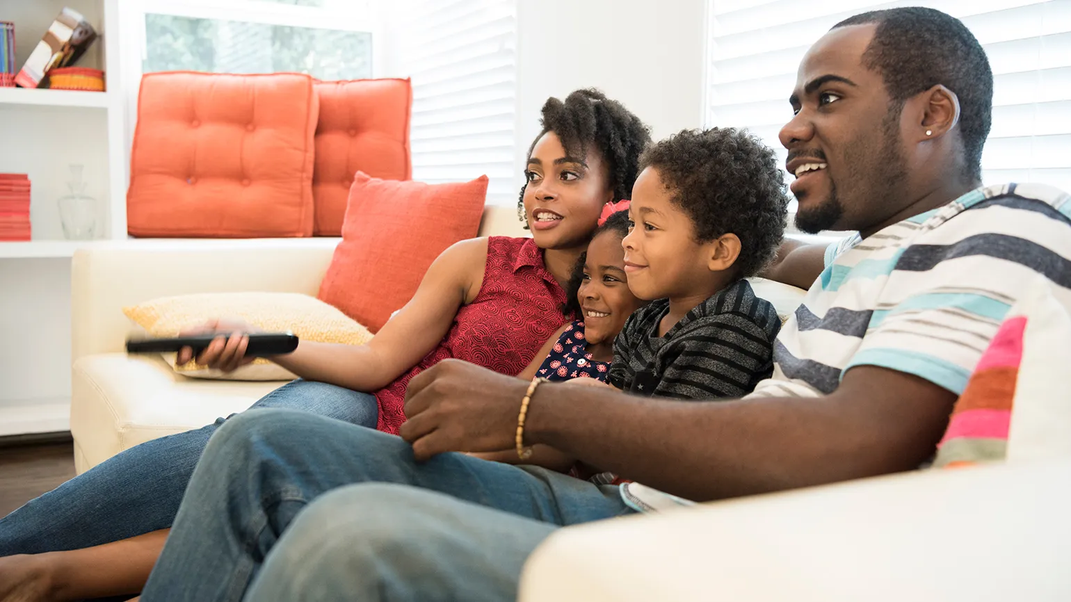 Family watching TV together