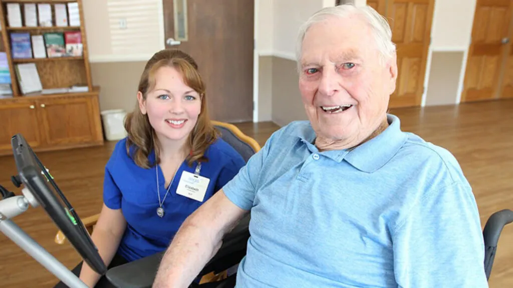 Speech pathologist Elizabeth Ballone with Jim Woods.