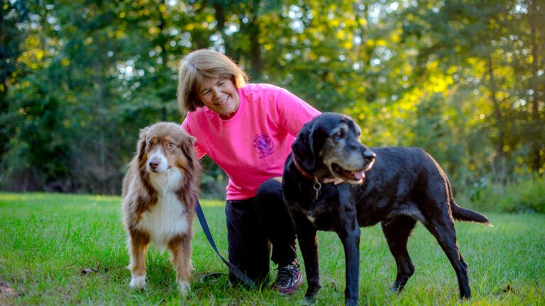 Amy's doggie family helped her through her grief after losing her beloved Kelly (left).