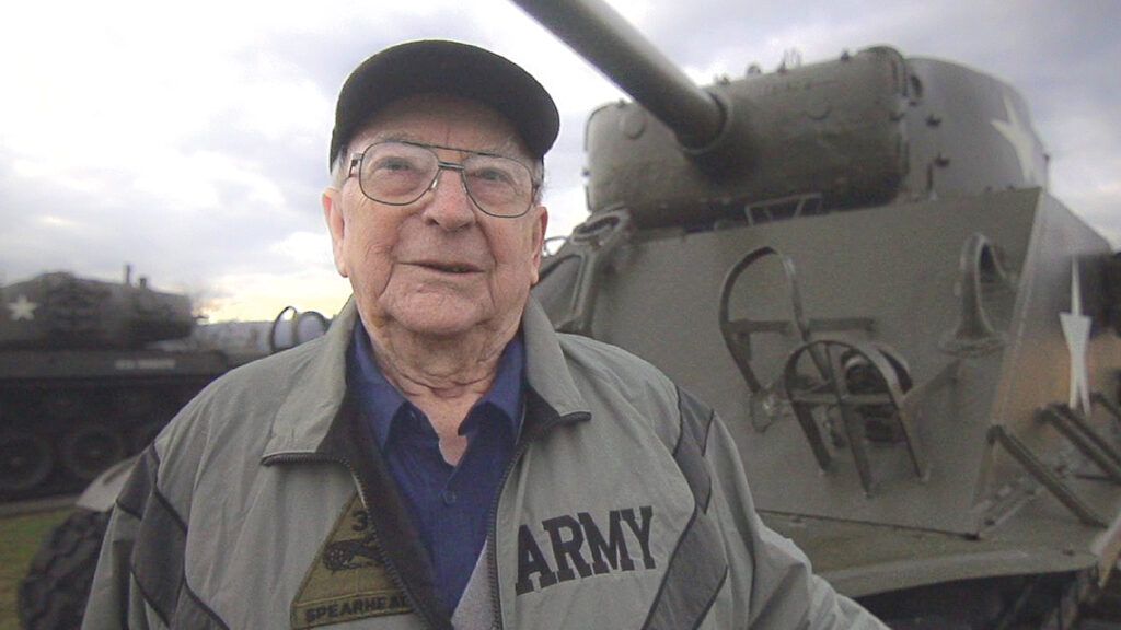 Clarence with a U.S. tank from World War II