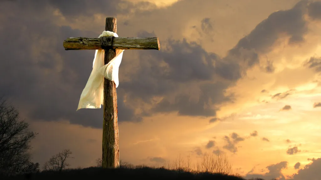 A cross among clouds depicting why Good Friday is important